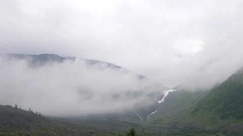 Clouds move between the mountains. Timelapse. Subpolar Ural. Uralic Mountains Stock Footage 269133366