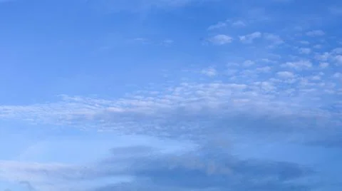 Clouds move in the blue sky Stock Photos