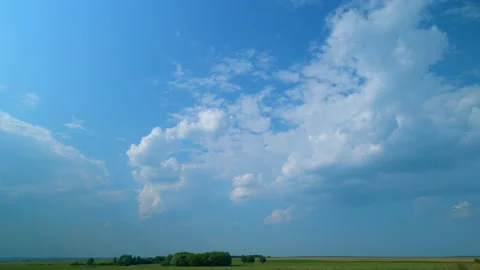 Clouds move in the blue sky. Running clouds against the blue sky. Time lapse. Stock Footage 208389369