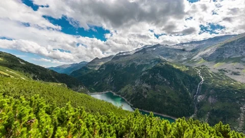 Clouds Move Fast Above Water Reservoir in the Alps Stock Footage 149911886