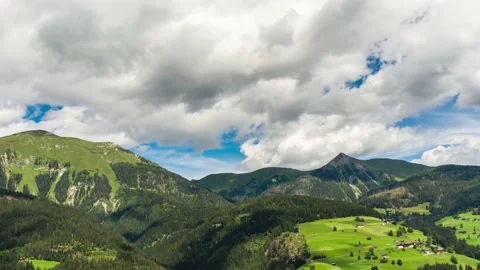 Clouds Move Fast Over Alpine Valley Creating Interesting Shadow Patterns Stock Footage