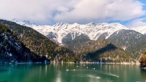 Clouds move at high speed across the sky, against the background of mountains Stock Footage 173244176
