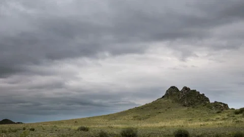 Clouds move over a cliff in overcast weather. Stock Footage 112249164