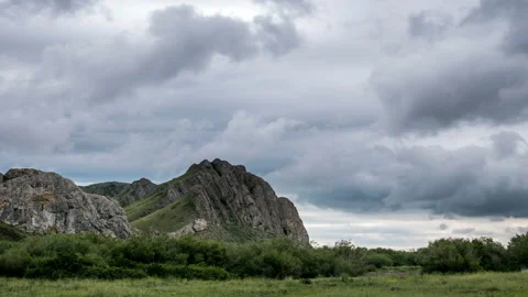 Clouds move over a cliff in overcast weather. Stock Footage 112249702