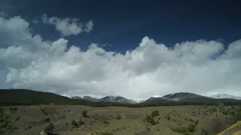 Clouds move over a hills, time lapse. Video stock 188126509