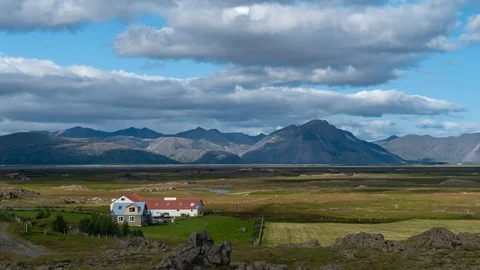 Clouds move over the mountains and the plain in Iceland Stock Footage 116531201