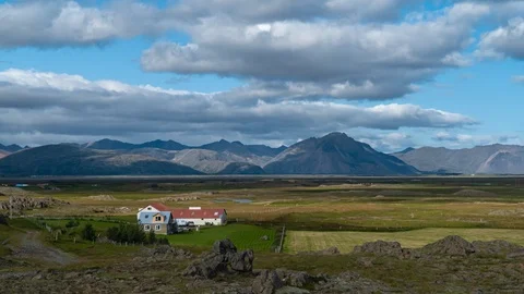 Clouds move over the mountains and the plain in Iceland Stock Footage 116874146
