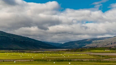 Clouds move over the mountains and the plain in Iceland Stock Footage 116874346