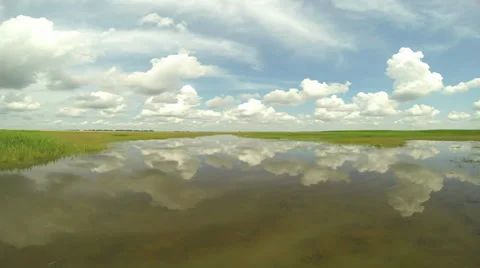 Clouds move reflected in the water Stock Footage 39874886