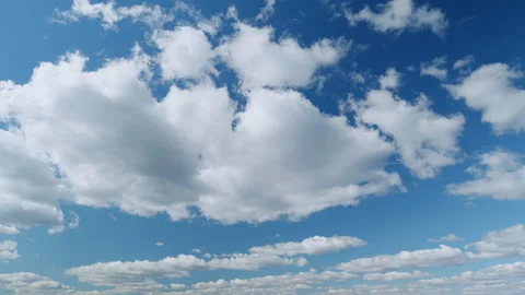 Clouds moves in the blue sky. Clouds running across brilliant blue sky. Natural Stock Footage 217691347
