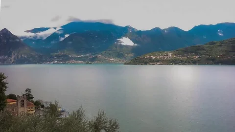 Clouds moves over a lake with boats and waves. Stock Footage 72956161