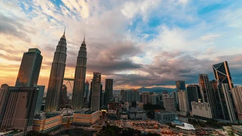 Clouds moving above modern skyline at sunset in Kuala Lumpur Stock Footage 233378982