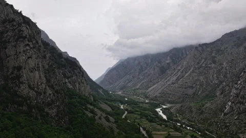 Clouds moving above mountain valley timelapse Stock Footage 318868979