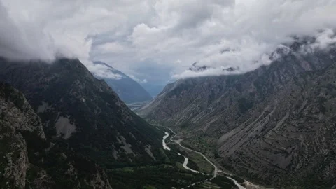 Clouds moving above mountain valley river timelapse Stock Footage 318869096