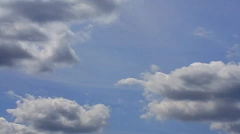 Clouds moving across a blue sky (timelaps) Stock Footage 7755837