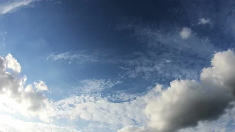 Clouds Moving Across the Blue Sky in 4k Stock Footage 95861422