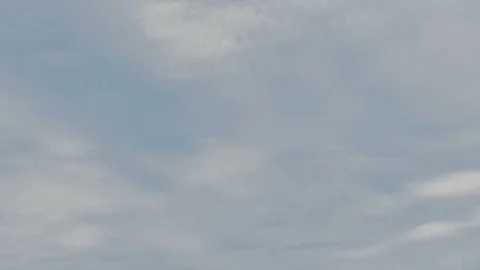 Clouds moving across blue sky. Stock Footage 115554809