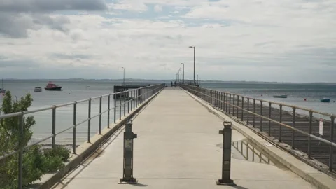 Clouds moving across pier Stock Footage 295079925