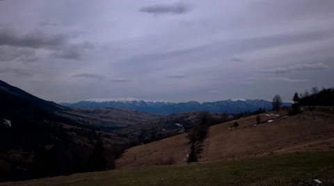 Clouds Moving Across a Snowy Mountains Landscape Vidéo 62015340