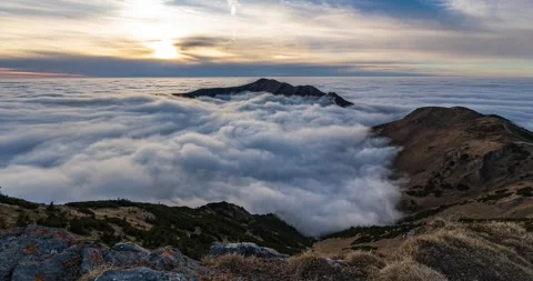 Clouds moving in alps mountains valley in autumn evening time lapse Stock Footage 295344231