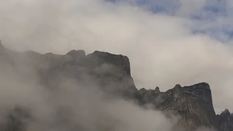 Clouds moving around the top of the Troll Walls,4k,timelapse Stock Footage 230212542