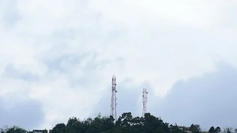 Clouds moving behind mobile tower Stock Footage 273030303