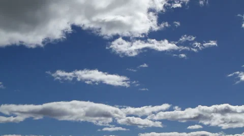 Clouds moving by blue sky Stock Footage 28839221