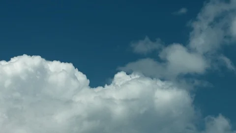 Clouds moving fast again st a dramatic blue moody sky. Stock Footage 98034528