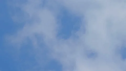 Clouds moving fast on a blue sky storm comming time lapse Stockbeeldmateriaal 151691506
