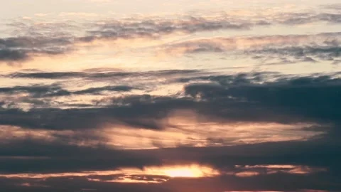 Clouds moving in fast motion with a warm sunset Stock Footage 231569853