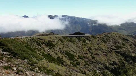 Clouds moving fast over mountains, Madeira, Portugal. Stock Footage 10568717