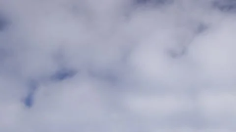 Clouds moving fast seen from airplane window during flight 스톡 동영상 310191179