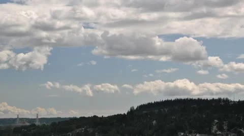 Clouds Moving Forward under a blue sky with mountain background Stock Footage 10711366