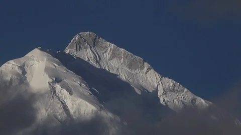 Clouds Moving in front of Rakaposhi Mountain Stockbeeldmateriaal 114188018