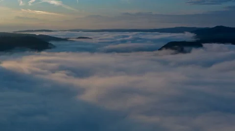 Clouds moving in german valley of river Mosel at sunrise Stock Footage 41336413