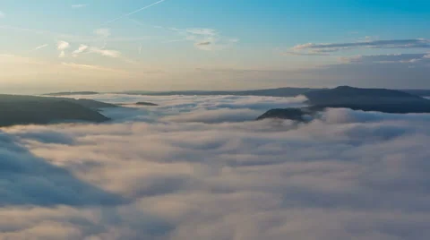 Clouds moving in german valley of river Mosel at sunrise Stock Footage 41337292
