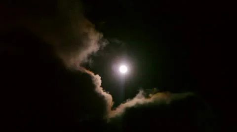 Clouds moving infront of the moon Stock Footage 8847808