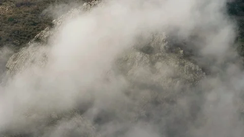 Clouds moving on a mountain Stock Footage 94596650