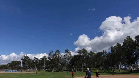 Clouds moving over baseball game 스톡 동영상 274868633