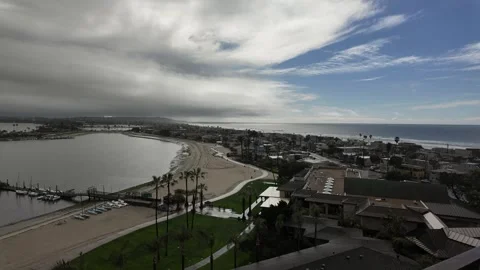 Clouds moving over beach town 스톡 동영상 279050100