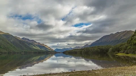 Clouds moving over calm South Mavora Lake,4k,timelapse Stock Footage 229800329