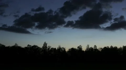 Clouds moving over the forest. 4K UHD timelapse. Stock Footage 64094765