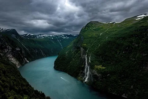 Clouds Moving Over Geirangerfjord Between Mountains With Waterfalls From Stock Footage 235980761