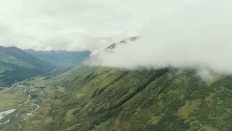 Clouds moving over green mountains Video stock 154555827