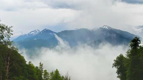 Clouds moving over the green mountains timelapse. Stock Footage 234068487