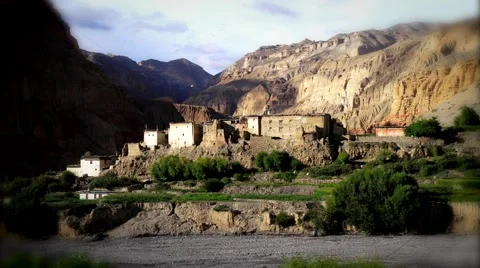 Clouds moving over houses and Himalaya mountains in Mustang, Nepal Stock Footage 62923865