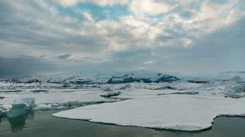 Clouds moving over an icy lagoon Video stock 154859965