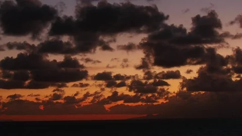 Clouds moving over landscape during sunset Stock Footage 74908393