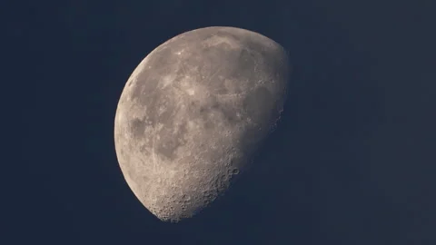 Clouds moving over the moon during Waning Gibbous phase at dawn Stock Footage 247511116