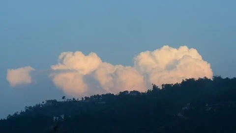 Clouds moving over a mountain Stock Footage 273494614